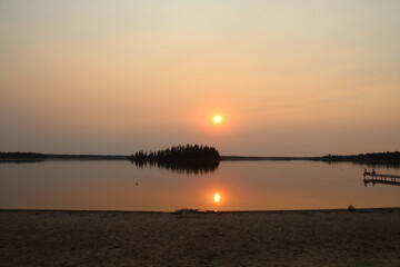 Naklejka premium Hazy July Sunset, Elk Island National Park, Alberta