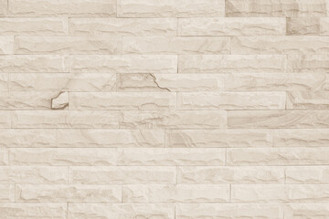 Obraz premium Empty background of wide cream brick wall texture. Beige old brown brick wall concrete or stone textured.