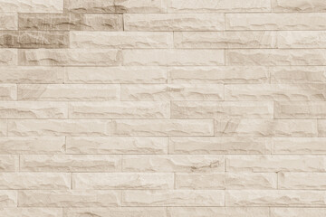 Empty background of wide cream brick wall texture. Beige old brown brick wall concrete or stone textured.