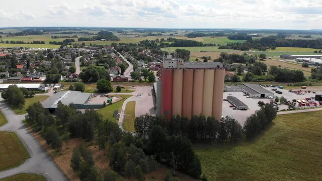Aerial landscape shot of Swedish company Lantmännen Lantbruk in agriculture industry, the grains storage silos, manufacturing factory site in rural countryside in Brålanda Vänersborg Sweden.