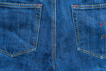 Fototapeta premium Blue Jeans background with pocket texture, denim with seam of fashion design.