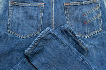 Fototapeta premium Blue Jeans and bleached background,denim with seam of fashion design with pocket.