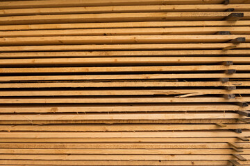 Hofsnas, Sweden Piles of fresh timber piled high waiting for a siding job.