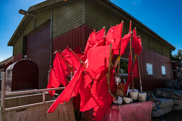 SIllerslev, Denmark Red fishing flags and buoys in a harbour.