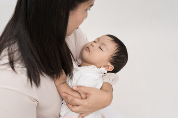 Her daughter fell asleep in her embrace.
