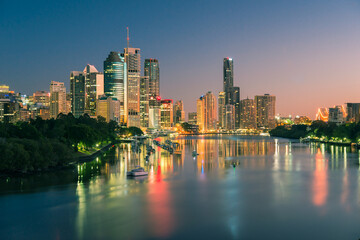 Evening view of Brisbane city buildings and river seen from Kangaroo Point. Brisbane is the state...