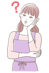頬に手を当てて考える若い女性