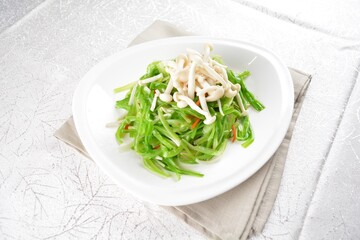stir fried dragon vegetable with white mushroom vegetarian in soy sauce in white background asian halal vegan menu