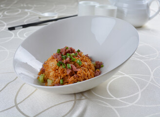 egg fried rice with black truffle, meat and seafood in dark sauce in white background asian halal vegan menu