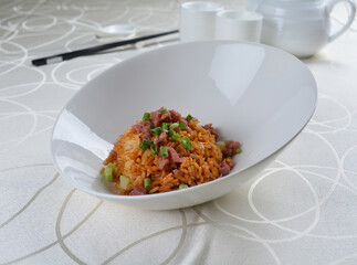 egg fried rice with black truffle, meat and seafood in dark sauce in white background asian halal vegan menu