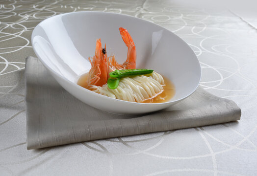 braised handmade thin noodle udon ramen with prawn and vegetable in premium stock soup in white background asian halal vegan menu