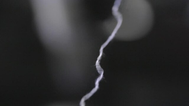 Macro Shot Of White Cotton Thread Sewing During Textiles Manufacturing 