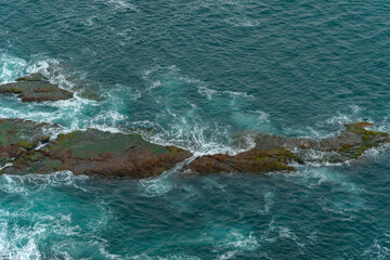 waves crashing on the rocks