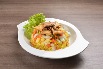 vegetarian nasi goreng fried rice with pineapple, vegetables meat in spicy chilli sambal sauce on wood background asian halal vegan menu