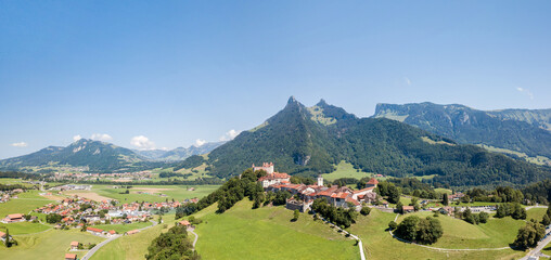 The aerial image of the medieval Gruyeres Castle on the hill top of Alps. It is one of the most popular tourist destionations.