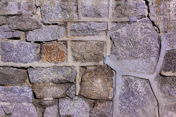 Stone wall texture with cement joints.