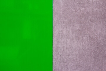 Fototapeta premium Polished green texture with gray wall texture. Space for text. Background. Modern design.