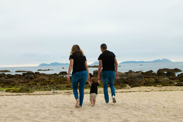 family walking on the beach
