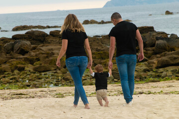 family walking on the beach
