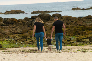 family walking on the beach