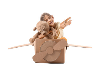 Little girl playing with toys on white background