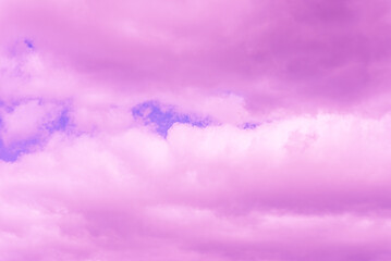 Obraz premium Beautiful dramatic pink cloud sky purple and violet tones Background.Toned.