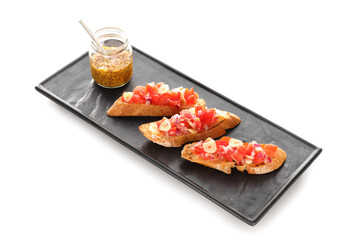Tasty bruschettas with tomatoes and Dijon mustard on white background