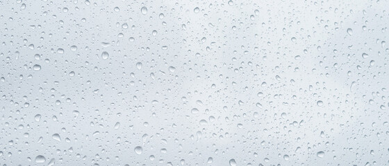 Rain drops and dew. water drops on a gray car roof after stopped raining , selective focus...