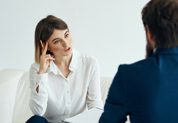 the patient sits with a psychologist psychotherapy communication stress