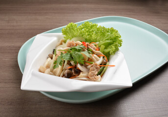 thai cold mushroom vegetable salad in spicy sour lime sauce on wood background asian halal vegan menu