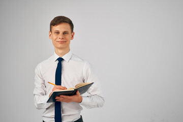 man in white shirt with tie documents work businessman office