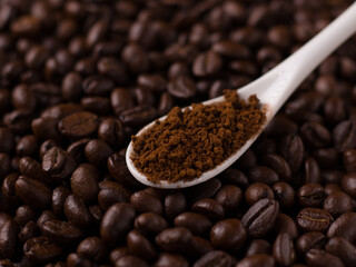 Coffee beans and powder with textured background stock image.