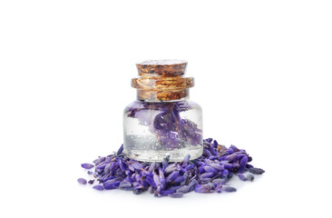 Bottle of lavender essential oil and flowers on white background