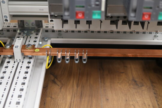 Copper electric busbars for the organization of protective grounding in the electrical panel.