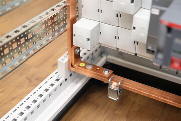 Copper electric busbars for the organization of protective grounding in the electrical panel.