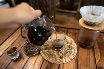 drip coffee on a wooden table at home