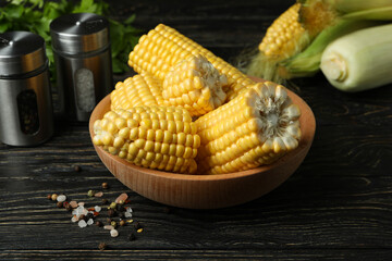 Fresh raw corn, parsley and spices on wooden table