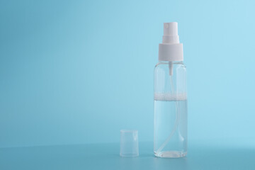 A transparent plastic bottle on a blue background