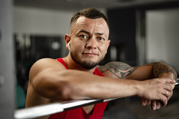 Obraz na płótnie Canvas Strong man athlete exercise in gym, close up portrait