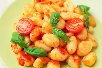 Plate with tasty gnocchi, closeup