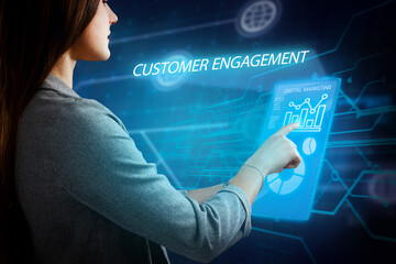 Business, Technology, Internet and network concept. Young businessman working on a virtual screen of the future and sees the inscription: Customer engagement