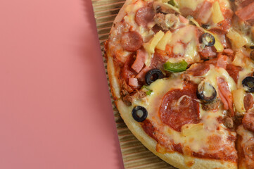 Super Supreme Mozzarella Cheese Pizza isolated on pink background