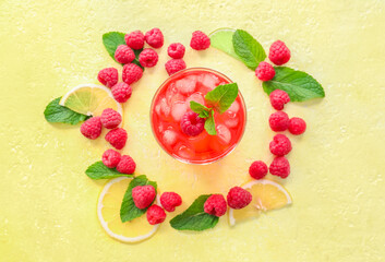 Obraz na płótnie Canvas Glass with tasty raspberry lemonade on color background
