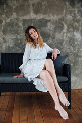 woman in a dress portrait on a gray background