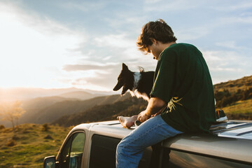 Hispanic traveler on his minivan on a sunrise