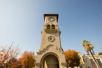 Daytime view of a historic public clock tower in downtown Bakersfield, California, USA.