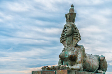 Fototapeta na wymiar Egyptian sculptures of sphinxes on the embankment. Saint Petersburg, Russia - 13 June 2021