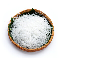 Vermicelli in bamboo basket on white background.