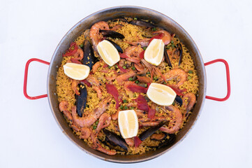 Spanish Paella,top view,isolated on white background.Tasty and delicious food