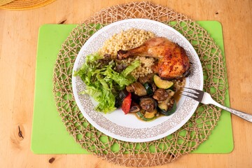 Chicken leg, vegetable, salad and pasta 